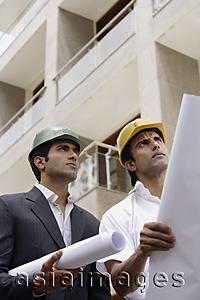 Asia Images Group - contractors or architects with blueprints