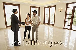Asia Images Group - agent with young couple
