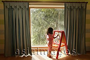 Asia Images Group - little girl at easel