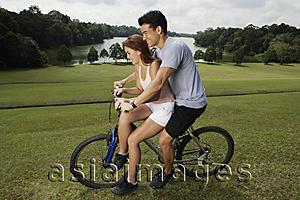 Asia Images Group - couple on mountain bike