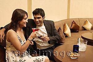 Asia Images Group - man and woman raising glasses in toast