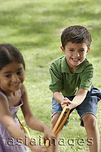 Asia Images Group - kids playing tug-o-war