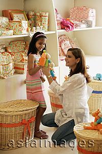 Asia Images Group - mother and daughter in toy store