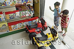 Asia Images Group - Little boys staring in toy store window