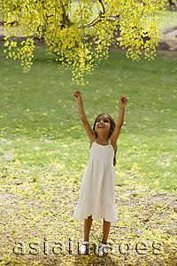 Asia Images Group - little girl reaching up to tree