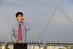 Asia Images Group - Businessman speaking on mobile phone