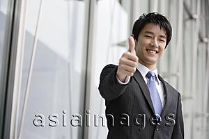 Asia Images Group - Businessman giving 