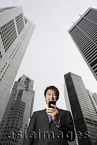 Asia Images Group - Businessman reading messages