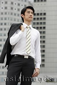 Asia Images Group - Portrait of businessman with jacket over shoulder