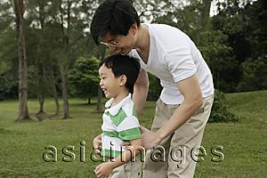 Asia Images Group - Father and son playing in park