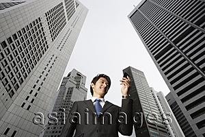 Asia Images Group - Businessman reading messages