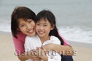 Asia Images Group - young woman and girl cheek to cheek