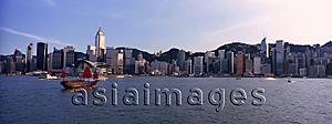 Asia Images Group - Hong Kong skyline with a chinese junk in the Victoria Harbour