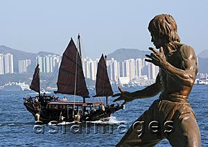 Asia Images Group - Chinese junk and Bruce Lee statue at Victoria Harbour, Hong Kong