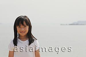 Asia Images Group - Young girl smiling at camera.