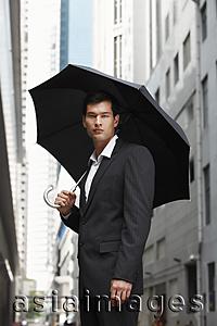 Asia Images Group - businessman holding umbrella