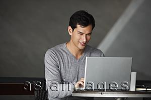 Asia Images Group - man working on laptop