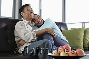 Asia Images Group - Young people hugging and smiling at home