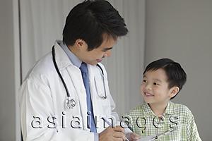 Asia Images Group - Doctor talking to young patient
