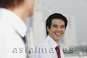 Asia Images Group - Business man laughing at another man