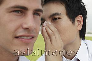 Asia Images Group - Close up of a man whispering