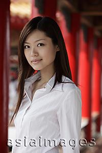 Asia Images Group - Head shot of Chinese woman looking at camera