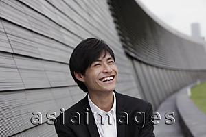 Asia Images Group - Chinese man laughing out side
