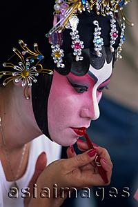 Asia Images Group - China,Hong Kong,Portrait of Chinese Opera Actress Applying Make-up