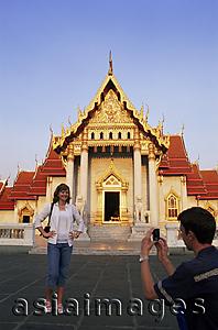 Asia Images Group - Thailand,Bangkok,Tourist Couple Taking Photos in Wat Po