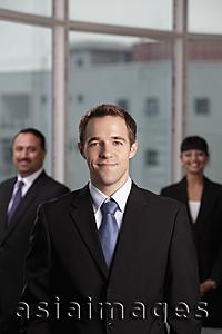Asia Images Group - Caucasian man standing in front of his colleagues