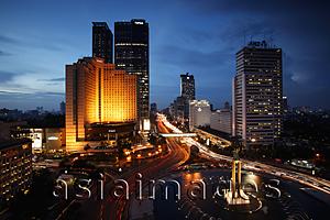 Asia Images Group - Night view of Hotel Indonesia roundabout, Welcome Monument and buildings along Jalan Thamrin, Jakarta