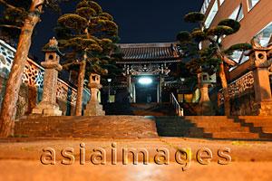 Asia Images Group - Entrance to Buddhist temple at night, Japan
