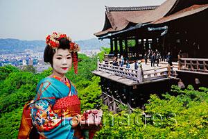 Asia Images Group - Geisha wearing a Kimono Posing in front of a Picture of Kiyomizu Temple. Kyoto, Japan