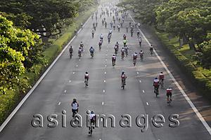 Asia Images Group - Cyclist riding down the road during a bike race