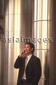 Asia Images Group - Male executive talking on cellular phone