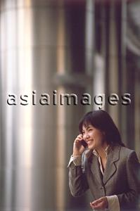 Asia Images Group - Female executive talking on cellular phone
