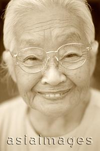 Asia Images Group - Mature woman with glasses, smiling, portrait