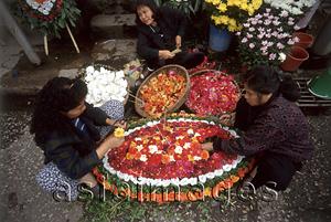 Asia Images Group - Vietnam, Hanoi, women making flower arrangements.