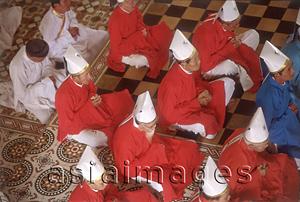 Asia Images Group - Vietnam, Tay Ninh, priests and worshippers in Cao Dai Great Temple.