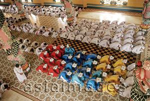 Asia Images Group - Vietnam, Tay Ninh, priests and worshippers in Cao Dai Great Temple.