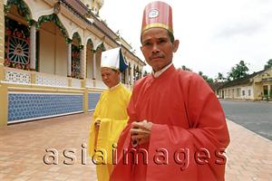 Asia Images Group - Vietnam, Tay Ninh, Cao Dai priests outside of Cao Dai Great Temple.