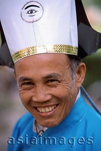 Asia Images Group - Vietnam, Tay Ninh, Cao Dai lay priest portrait (close up).