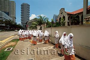 Asia Images Group - Singapore, Arab Street, Muslim students wearing traditional costume to Muslim school.
