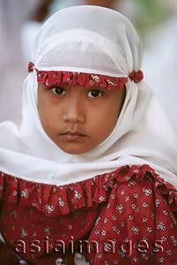 Asia Images Group - Indonesia, Aceh, Muslim girl in traditional prayer robes (close up).