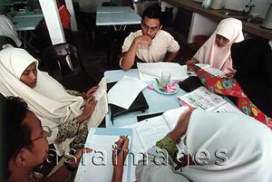 Asia Images Group - Malaysia, Kuala Lumpur, Muslim men and women study together at the International Islamic University.