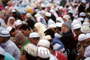 Asia Images Group - Malaysia, Kota Bahru, Muslims sit on dusty streets to listen to Pan -Malaysian Islamic Party speech.