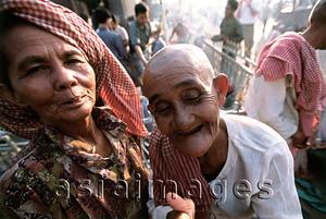 Asia Images Group - Cambodia, Phnom Penh, Mekong River, worshippers at pagodas.