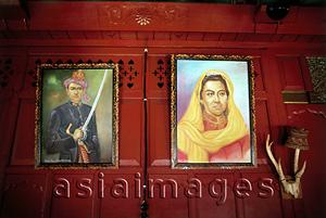 Asia Images Group - Indonesia, Aceh, Pictures of Acehnese royalty adorn the walls of a house in Banda Aceh.