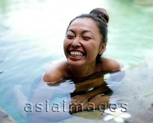 Asia Images Group - Woman in pool smiling