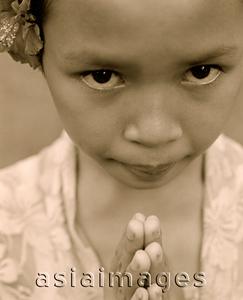 Asia Images Group - Indonesia, Bali, young girl, traditional greeting, portrait, close-up